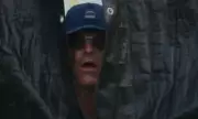 Jim Harbaugh's Bizarre Curtain Peek Goes Viral – NFL Coach's Odd Antics Steal the Spotlight