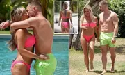 Kerry Katona, 44, flaunts her new boob job in a bikini as she enjoys steamy PDA with toyboy lover Paolo Magaglione, 33, in Ibiza