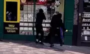 Shocking CCTV Footage Captures Masked Thieves Smashing Pawnbroker's Shop in Broad Daylight
