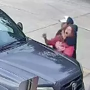 Shocking CCTV Footage Shows Man Dragging Woman Into Car in Terrifying Daylight Attack