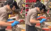 Shocking Footage: Fast Food Worker Spits on Customer's Burger in Disgusting Act