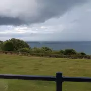 Shocking Moment: Tourist Films Two Sharks Circling Near UK Beach – Are They Dangerous?