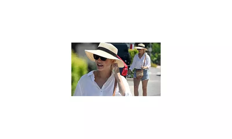 Holly Willoughby Stuns in Denim Shorts and Chic Linen Shirt During Sunny Portugal Getaway