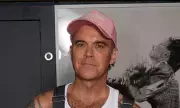 Robbie Williams Revives Iconic Dungarees Look Amid Hair Thinning Revelation | Daily Mail