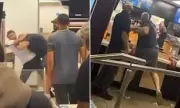 Shocking Brawl Erupts at McDonald's as Customer Jumps Counter and Attacks Staff