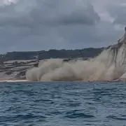 Shocking Moment Cliff Collapses Onto Beach in Front of Startled Sunbathers in Dorset
