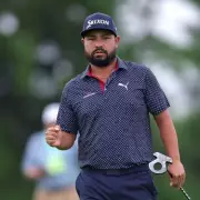 Tiger Woods and JJ Spaun Lead the Pack in Thrilling Golf Showdown