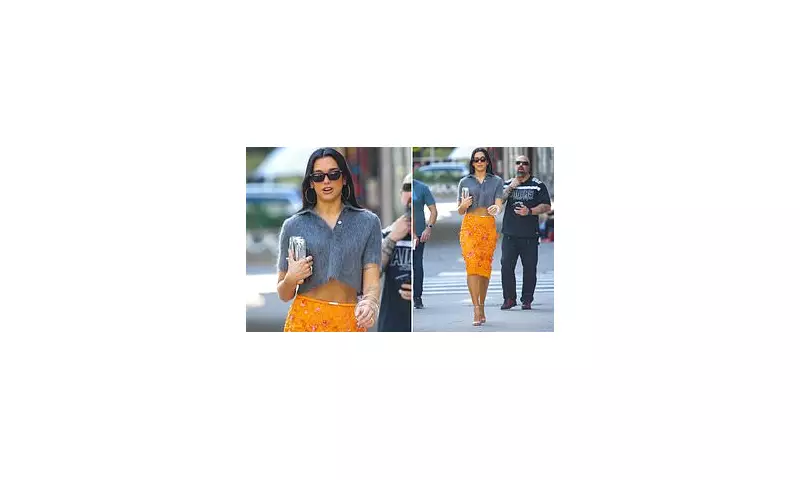 Dua Lipa Turns Heads in NYC with Bold Orange Gucci Skirt and Mohair Crop Top | Daily Mail