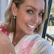 Amy Dowden's Bow Cardigan: Strictly Star's Heartfelt Style Statement Post-Surgery