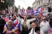 Tommy Robinson's 'Unite The Kingdom' March: Heavy Police Presence as Far-Right Leader Returns to Streets