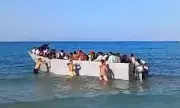 Tourists Forced to Push Migrant Boat Ashore on Greek Island Beach | Exclusive