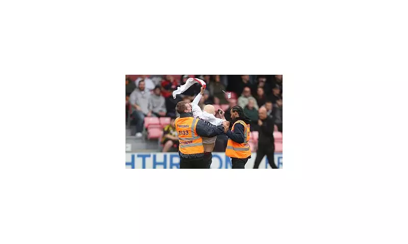 Gary Neville Branded 'Traitor' in Shocking Salford City Pitch Invasion Protest