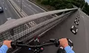 Daredevil E-Bike Rider Sparks Motorway Mayhem: Shocking Footage Shows Reckless Bridge Stunt
