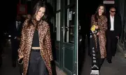 Emily Ratajkowski Stuns in Leopard Print During Paris Fashion Week Outing With Mystery Male Companion