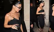 Kylie Jenner's Paris Fashion Week Exit: Sip & Style in a Sleek Black Dress