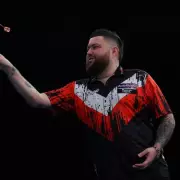 Michael Smith's Grand Slam Darts Triumph: St Helens Star Battles Through Illness to Claim Victory