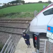 Shocking CCTV Captures Teenager's Reckless Train Roof Stunt in Hair-Raising Near-Miss