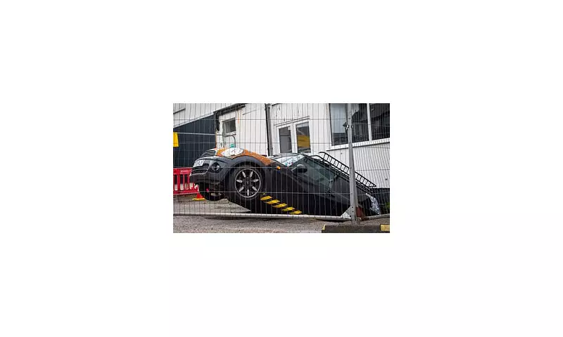 Mini Cooper Plunges Into Sinkhole: Dramatic Rescue Operation as Vehicles Nearly Follow