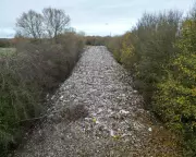 Fly-Tipping Scandal: Oxfordshire River Polluted by Illegal Waste Dump