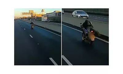 Reckless Biker's 'Superman' Stunt on UK Road Sparks Police Probe