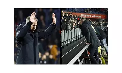 Robin van Persie leaps over hoardings to confront fans after Feyenoord's 8th loss