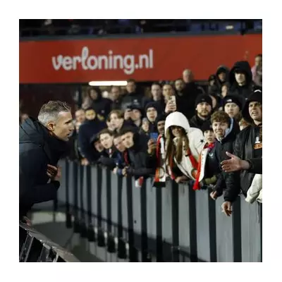 Van Persie leaps over boards to confront furious fans after Feyenoord's 8th loss