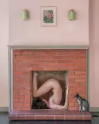 Artist's Nude Fireplace Self-Portrait with Stray Kitten Captivates Social Media