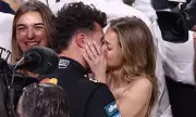 Lando Norris Celebrates F1 Title with Kiss from Girlfriend Magui Corceiro