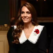 Princess Kate's Festive Fashion: A Royal Red Dress Reworn at Palace Lunch