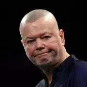 Raymond van Barneveld hints at retirement after 'suffering' World Darts Championship exit