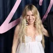 Sienna Miller, 43, Reveals Third Pregnancy at Fashion Awards in Sheer Gown
