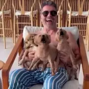 Simon Cowell, 66, shows off buff Barbados body in topless snaps with beloved dogs