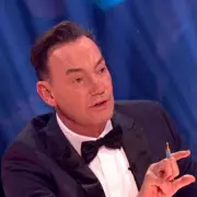 Strictly's Craig Revel Horwood Vows to Stay: 'I'll Be Dragged Out Kicking and Screaming'