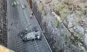Sydney Train Chaos: Car Plunges Onto Tracks, Halting Major Line