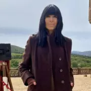 Claudia Winkleman's Traitors Coat Still In Stock: Get The Look For Less