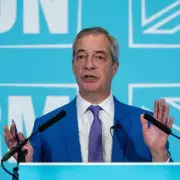 Farage Rally Dismisses Racism Claims as 'Smear' Amid Trump Bust Merchandise