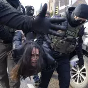 ICE Issues Stark Warning After Video Shows Disabled Woman Dragged From Car