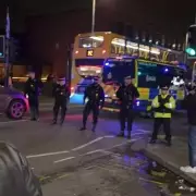 Manchester's Curry Mile Sealed Off After Violent Protest Erupts