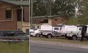 Manhunt ends with arrest after woman's body found in Queensland property
