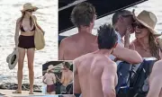 Model's Boat Kiss Sparks Buzz as Billionaire Beau Watches On