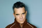 Robbie Williams Surpasses The Beatles With Historic 16th UK Number One Album