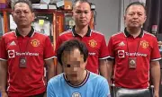 Thai Police Mock Arrested Man City Fan by Wearing Manchester United Shirts