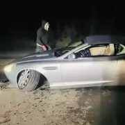 Aston Martin Wrecked by Pothole: Father and Daughter's Lucky Escape