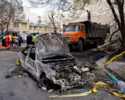 Damaged Car in Tehran After Israeli-US Strike, Iran's Strategic Dilemma