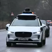 Driverless Car Emergency Stop Triggered by Mistaking Bus Advert for Pedestrians
