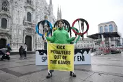 Greenpeace Stages Milan Olympic Torch Protest Over Eni Sponsorship