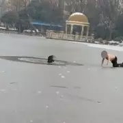 Heroic Father Risks Life in Frozen Lake Rescue of Boy Who Fell Through Ice