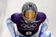 IOC Urges Ukrainian Skeleton Athlete to Compete Amid Helmet Controversy