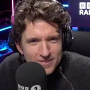 Niall Horan's Prank Call to BBC Radio 1 Fools Host Greg James with Accent