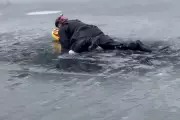 Police Rescue Man from Frozen Lake During Coincidental Training Session